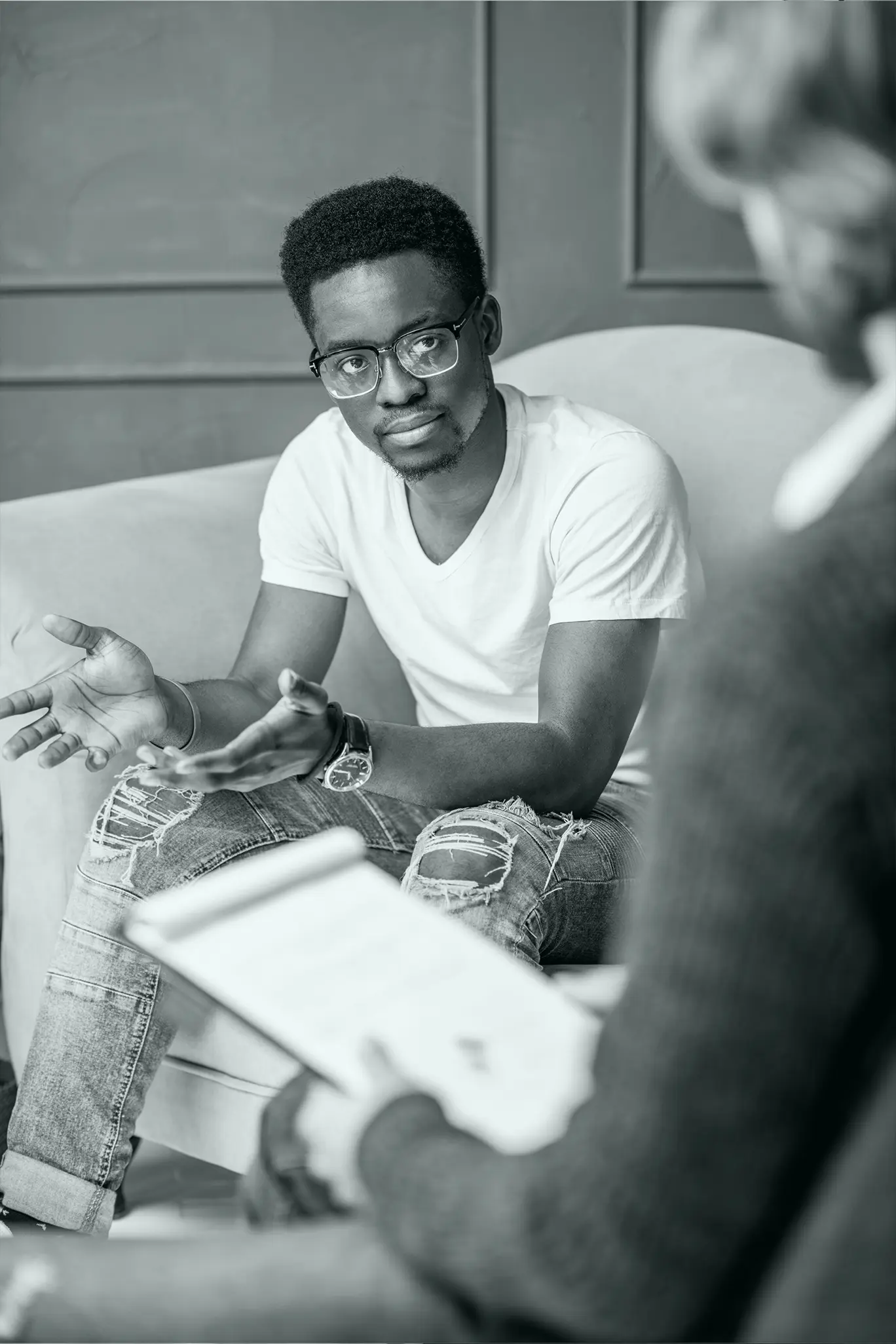 A man talking to his psychologist during therapy session