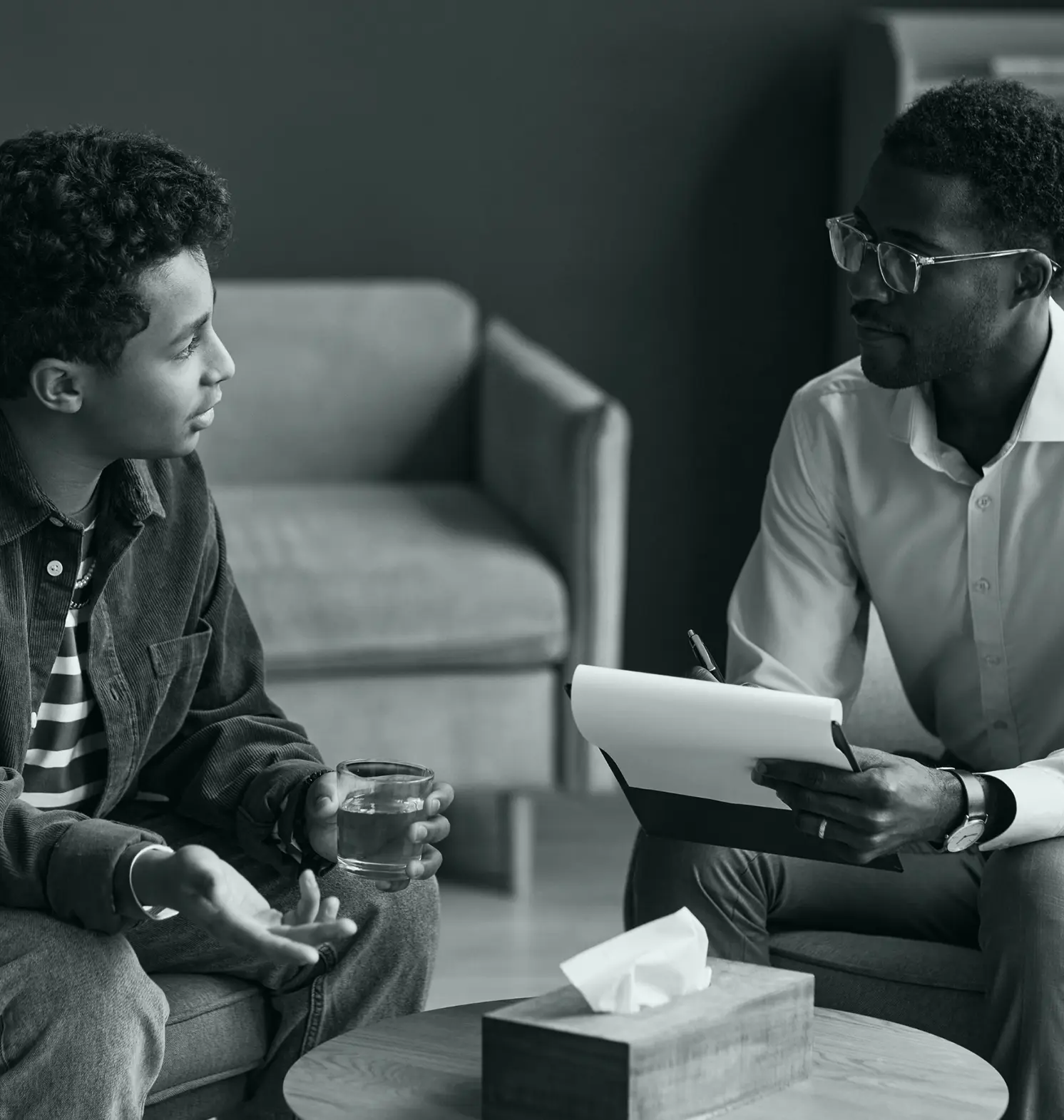 A psychologist with a young patient during a therapy session