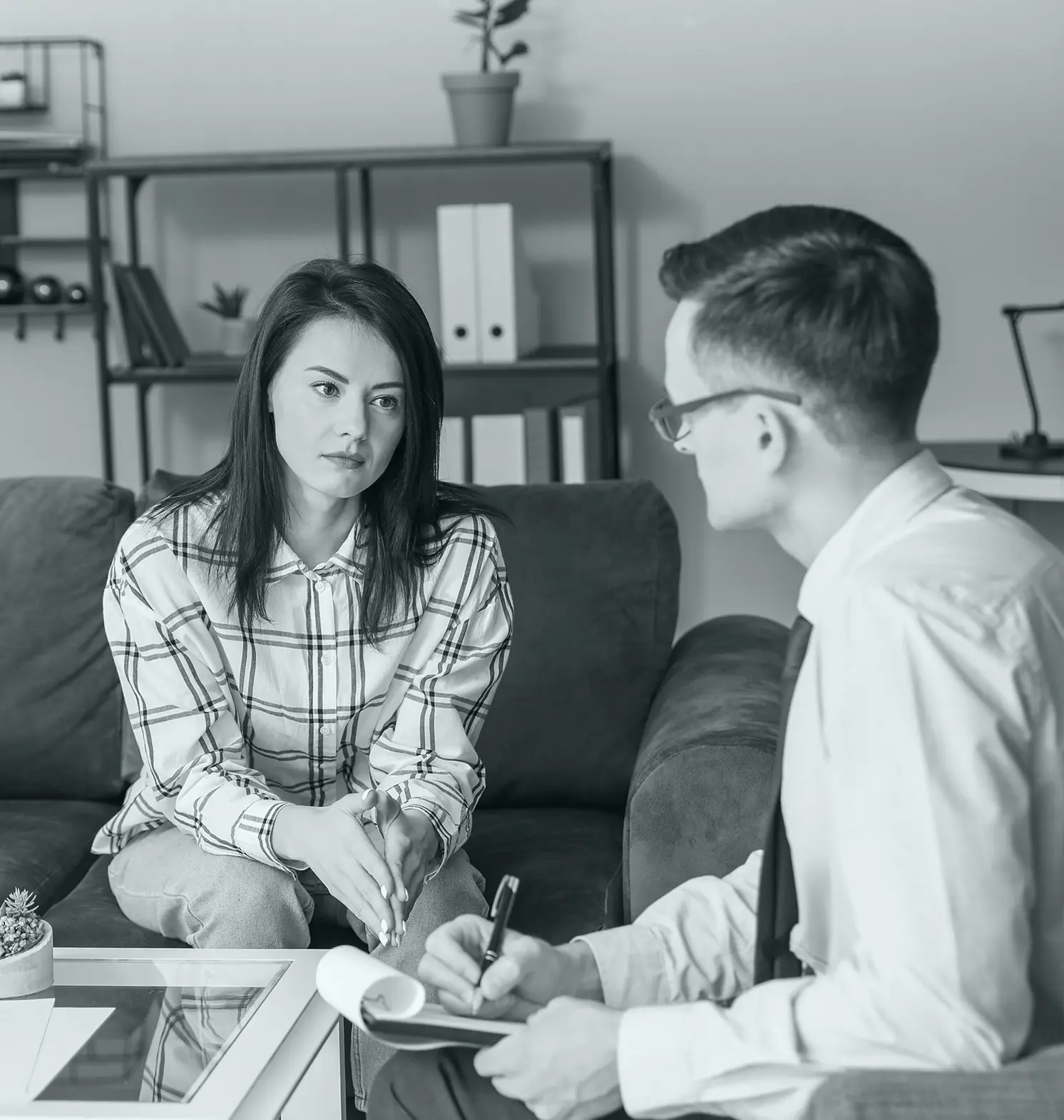 A psychologist during a therapy session with patient