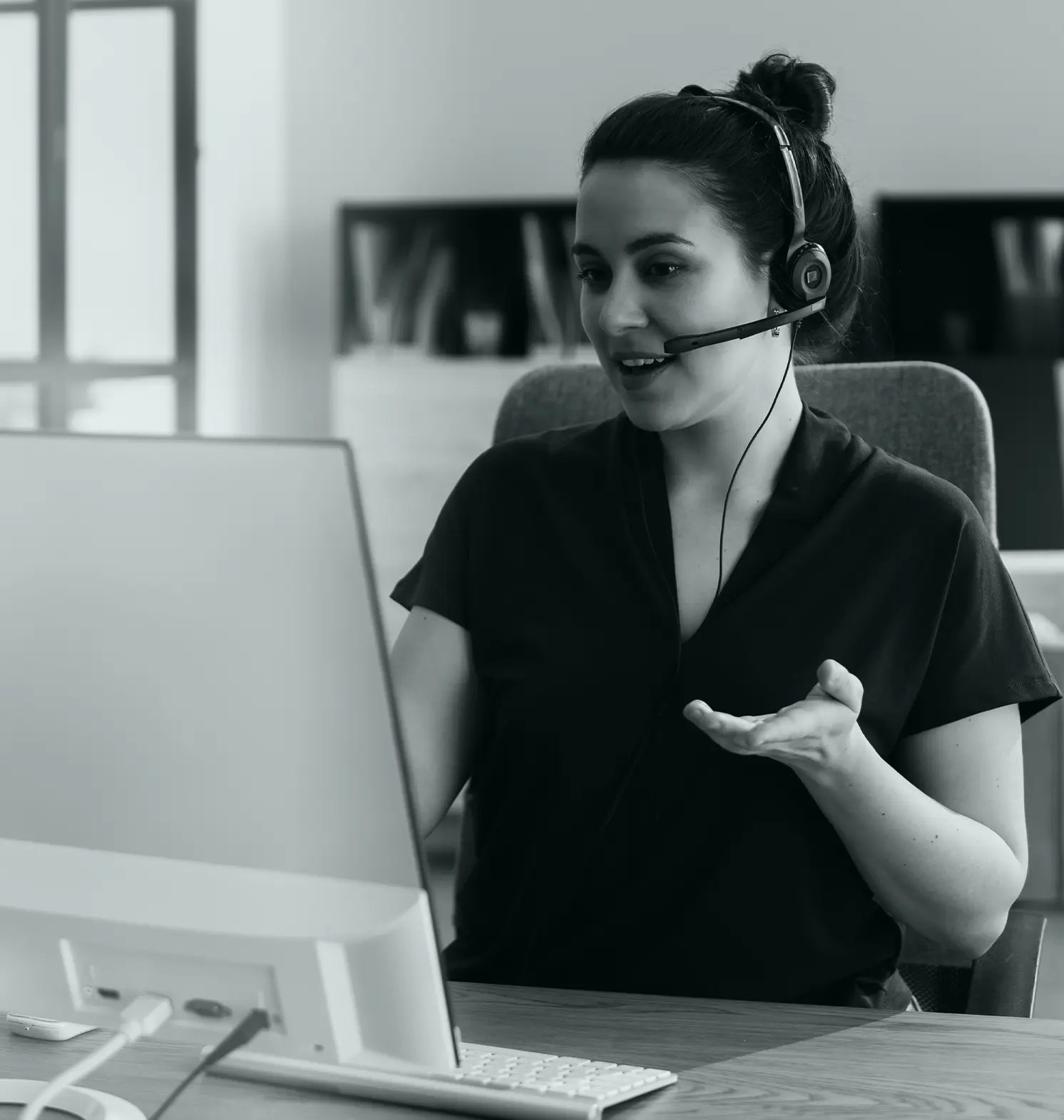 front desk assistant doing TMS clinic administration work